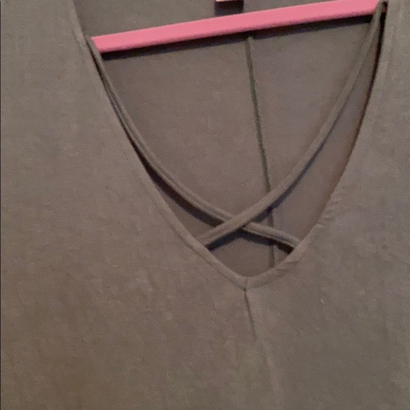 A olive green light shirt. Never worn. - Picture 2 of 3